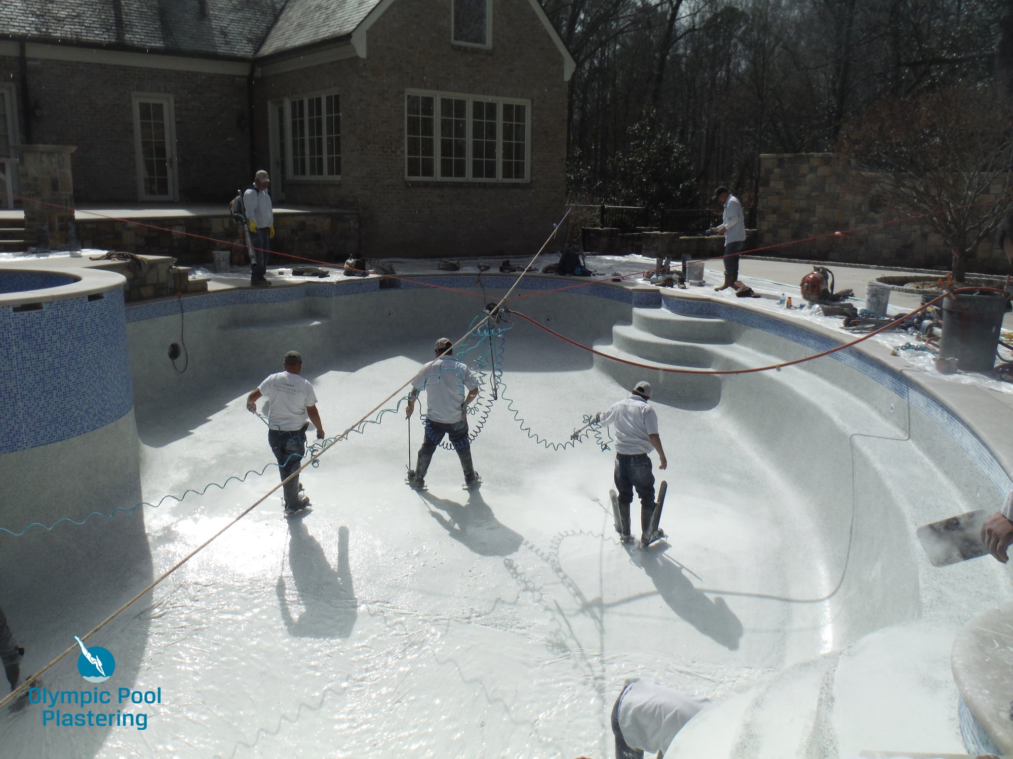 Finished resurfaced pool with water