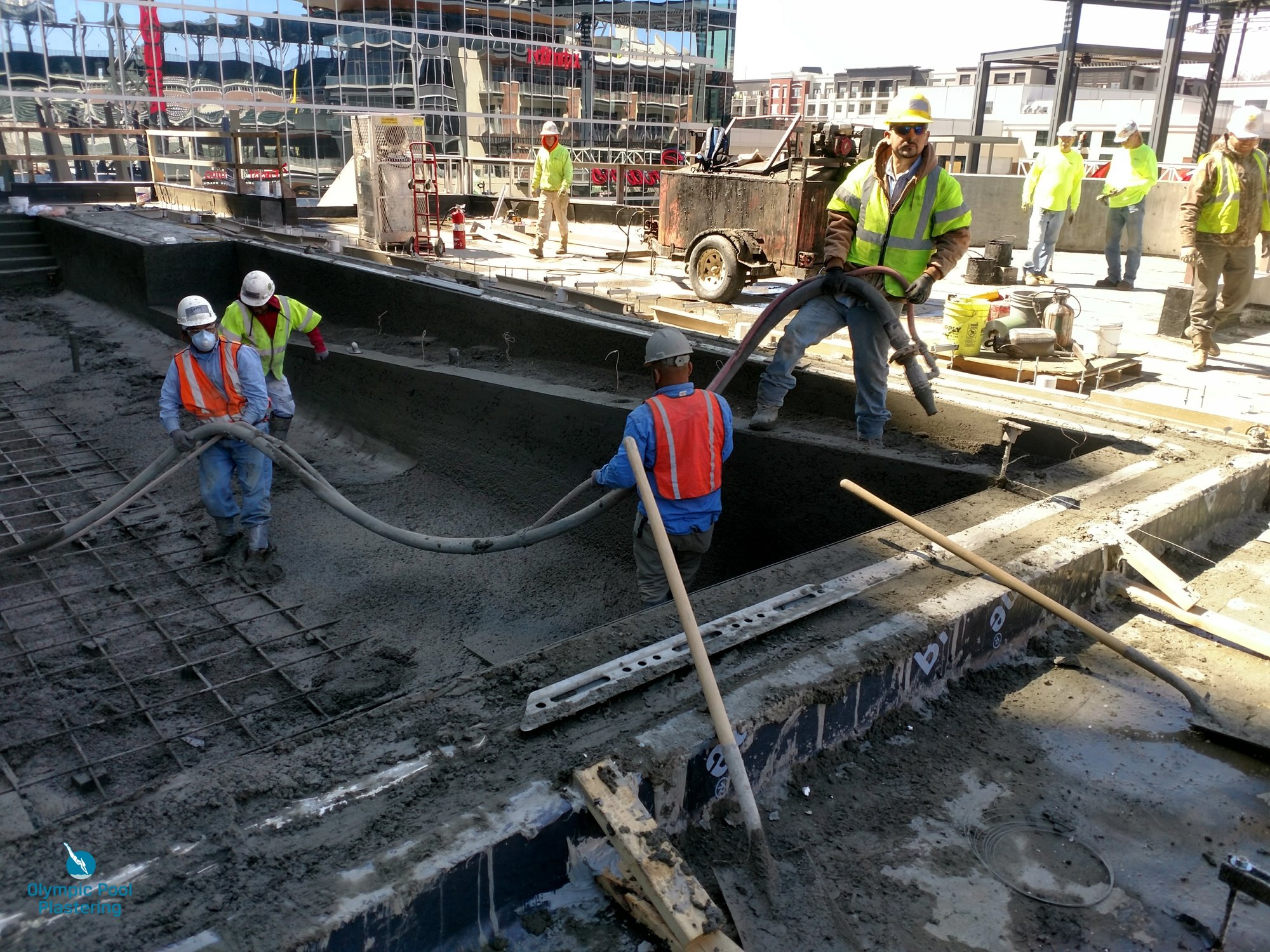 Olympic Pool Plastering crew applying finish